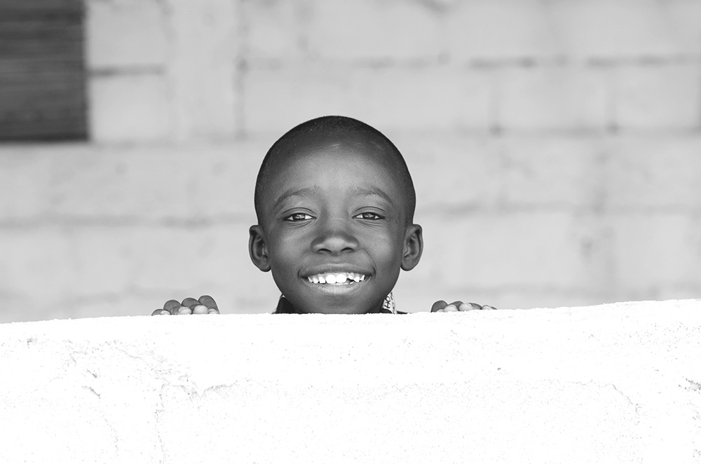 Little African Adorable Boy Smiling with Copy Space Background